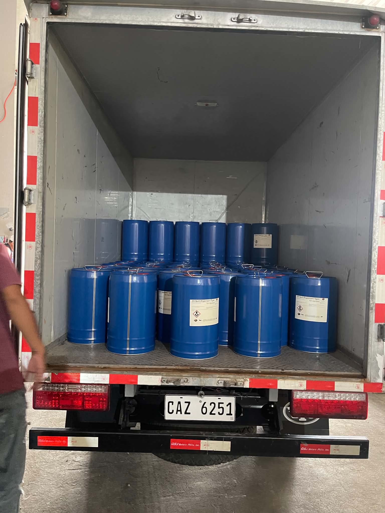 Product drums loaded into a delivery truck