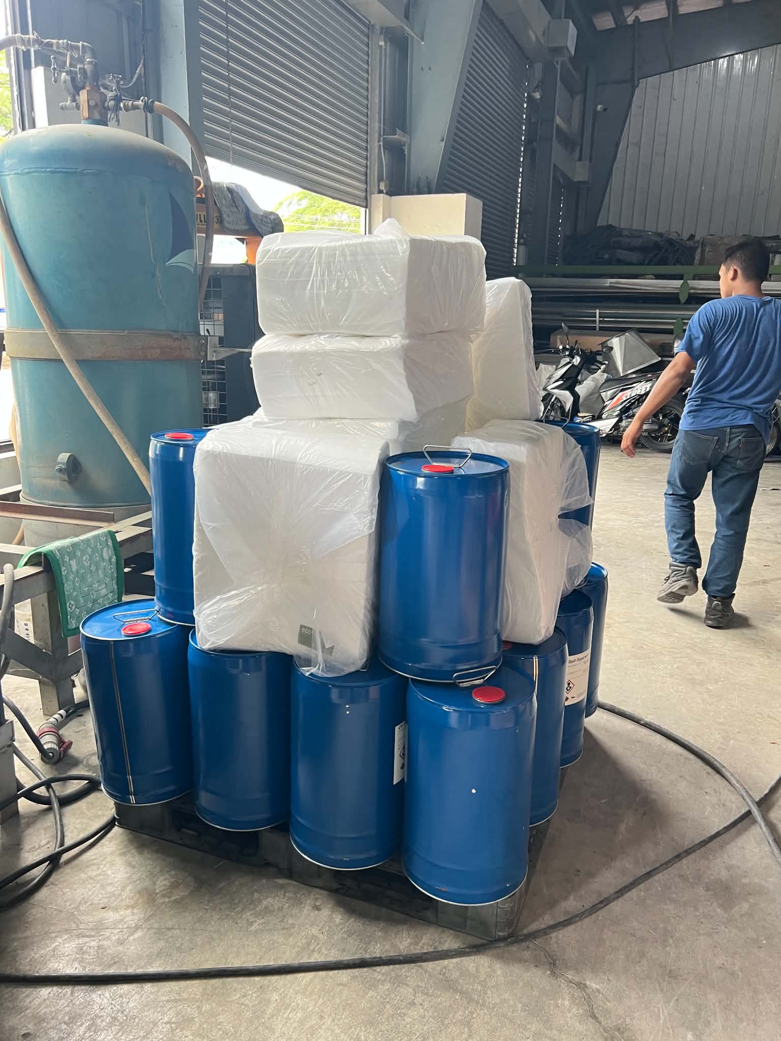 Warehouse operations with forklift and product drums