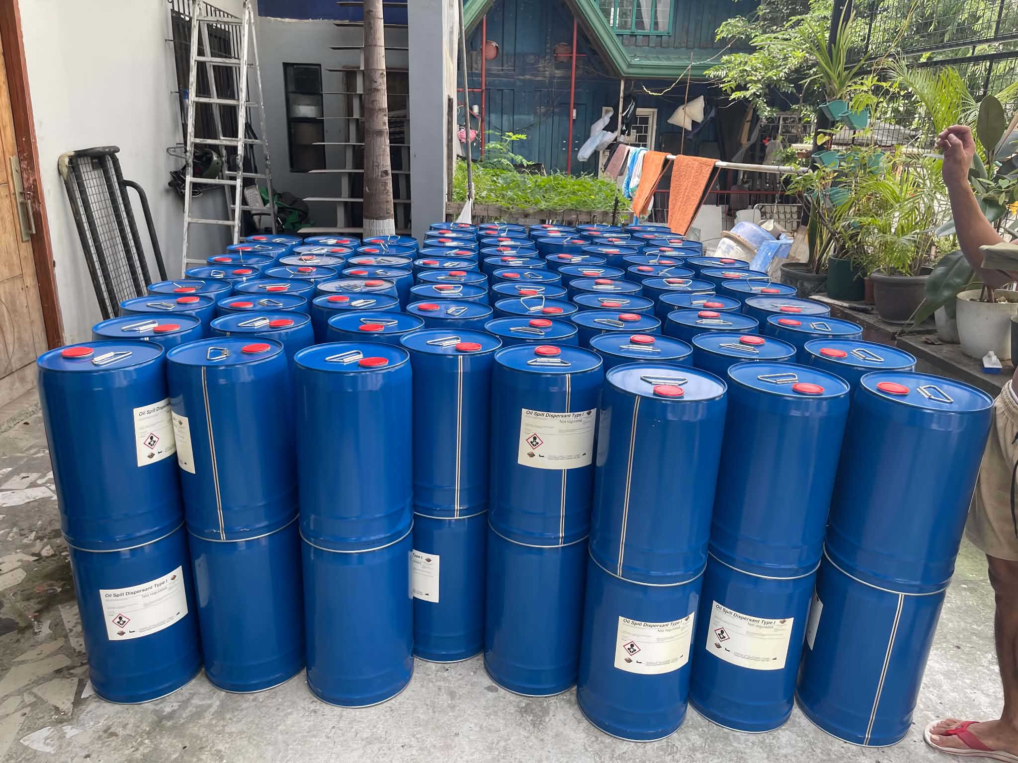 Warehouse with wrapped pallets and product drums